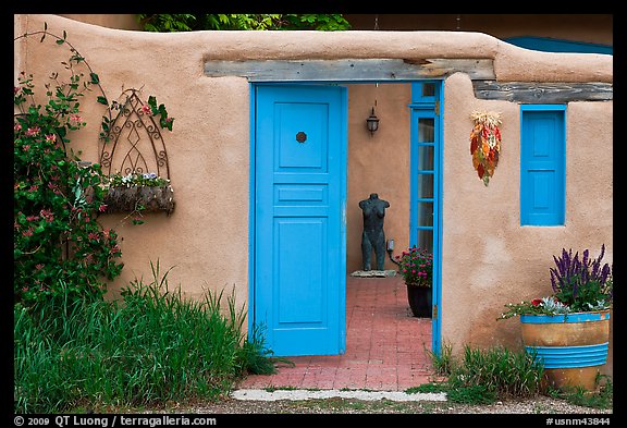 This Taos adobe resembles the traditional style all throughout NM, including a charming garden and ristra